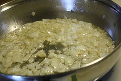 Chopped onions sautéing in pan