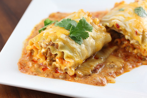 Taco lasagna roll up topped with melted cheese