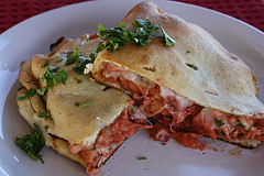 Baked bbq chicken calzones on plate