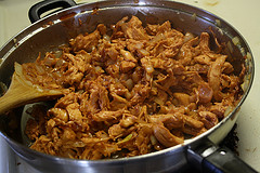 Bbq chicken cooking in skillet