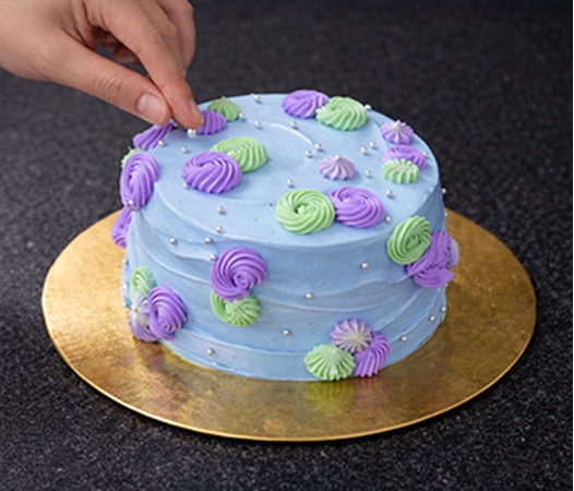 Butterscotch cake with frosting and decorations