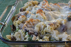 Chicken alfredo casserole before baking with cheese topping