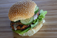Grilled chicken burger with lettuce and cucumber