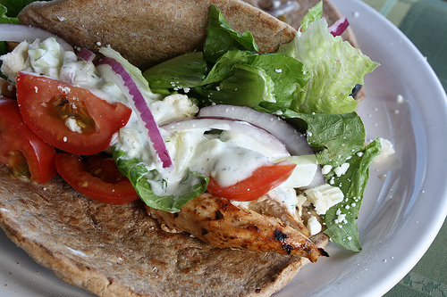 Chicken gyros with lettuce tomato and onion