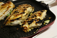 Grilled lime marinated chicken breasts in pan