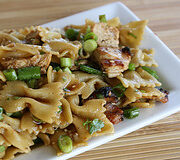 Sesame chicken pasta salad on white platter