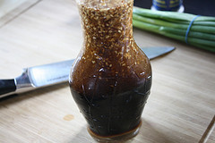 Homemade sesame dressing in glass bottle