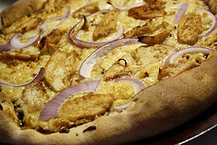 California chicken pizza with red onions