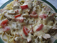 Chicken alfredo over fettuccine pasta