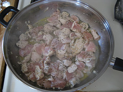 Chicken pieces cooking in skillet