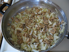 Mushrooms and onions cooking in pan