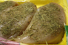 Raw chicken with dried herbs seasoning