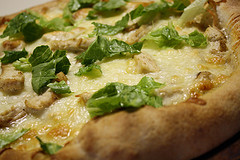 Chicken caesar salad pizza with lettuce