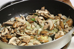 Mushrooms and onions sautéing