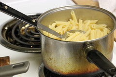 Boiling penne pasta in pot