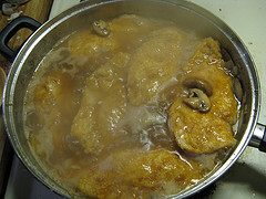 Chicken piccata simmering in sauce