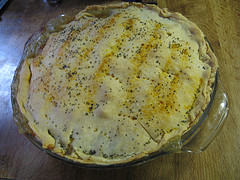 Baked chicken pot pie in glass dish