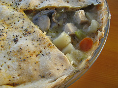 Chicken pot pie with flaky crust slice