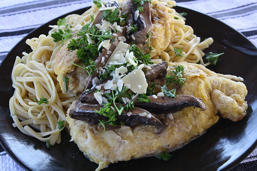 Close up chicken scallopini with spaghetti
