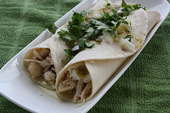 Chicken enchiladas topped with green sauce