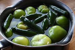 Tomatillos and jalapenos boiling for salsa verde
