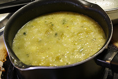 Green enchilada sauce simmering in pot