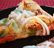 Fajita chicken pizza slice with melted cheese
