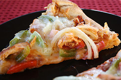 Fajita chicken pizza slice with melted cheese