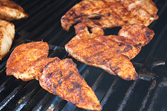 Spiced chicken grilling for fajita pizza