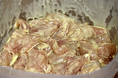 Chicken pieces marinating in sauce