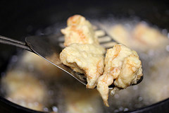 Chicken frying in hot oil