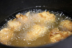 Chicken frying in hot oil