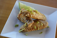 Fried chicken wings with lime zest