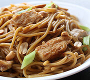 Chicken peanut noodles with chopped peanuts