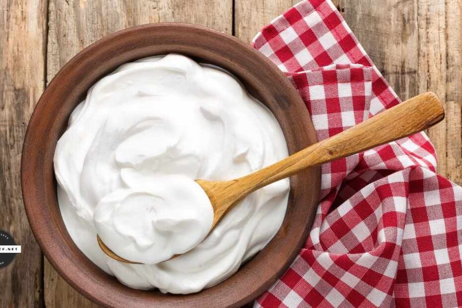 Bowl of Greek yogurt on table with checkered napkin